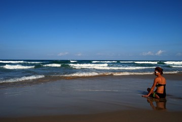 Woman on the beautiful beach of sea
