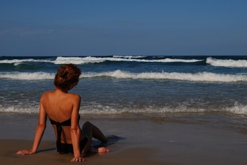 Woman on the beautiful beach of sea