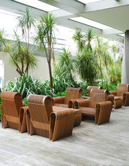 business patio with curved wooden table and chairs