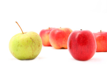 many apples in background with two apples in foregroung