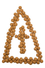 Obraz premium Little ginger nuts in the form of the mitre of Santa Claus.