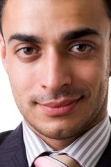 Fototapeta premium Young business man. The beautiful face close up.