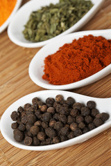 Assortment of spices with shadow in the background. Shallow DOF