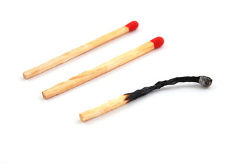 Some red matches isolated on a white background.