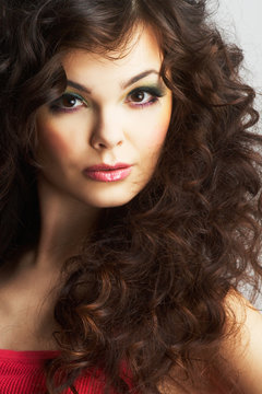Portrait of sexy woman with beautiful make-up and  curly hair