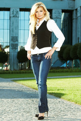 nice blond girl in jeans - outdoors photography