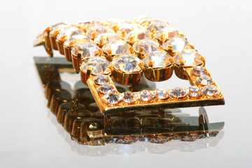 jewel close-up with many diamonds and gold like materials