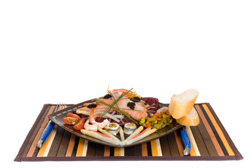 Gourmet smoked salmon dish, garnished with shrimp,