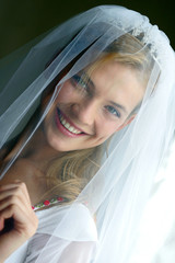 Portrait of beautiful bride in traditional white wedding dress