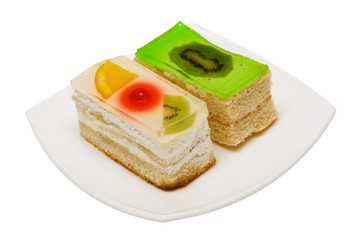 Sweet cakes with fruit on a white background