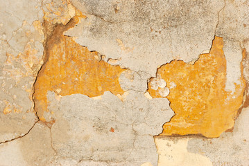 old wall with broken pieces of cement