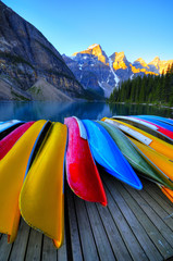 Canoes rest on the dock of Lake Moraine, Banff, Canada