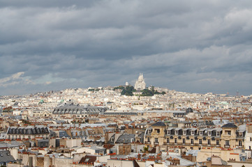 Fototapeta na wymiar Roofs of Paris with Basilique du Sacre Coeur in background
