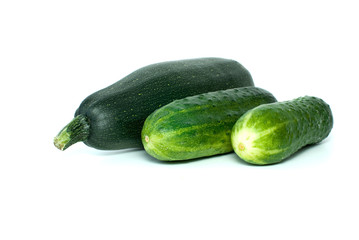 Cukini and pair of cucumbers isolated on the white background