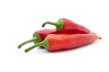 Three red hot peppers isolated on the white background