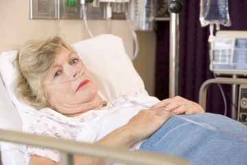 Obraz na płótnie Canvas Senior Woman Sleeping In Hospital Bed