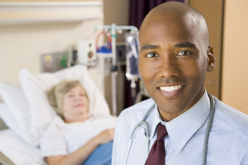 Fototapeta premium Doctor Smiling,Standing In Hospital Room