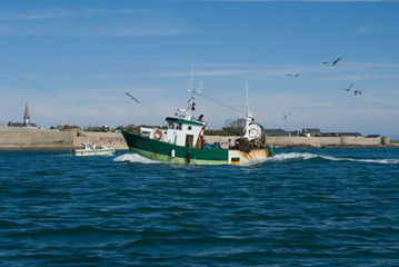 Fishing boat by St Louis Fortress in Brittany, France