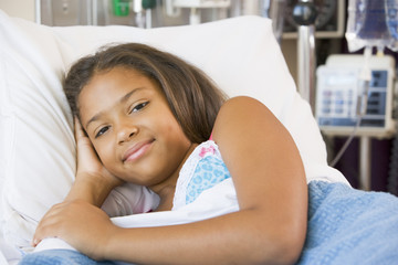 Obraz na płótnie Canvas Young Girl Resting In Hospital Bed
