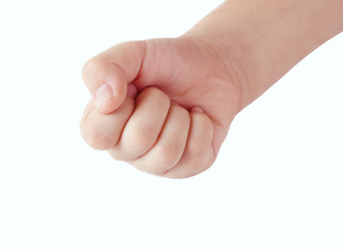 Close up of a child's fist on white background