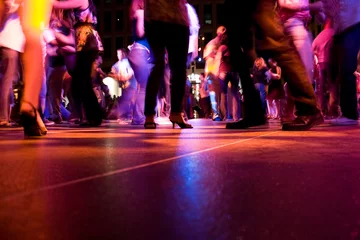 Fototapeten A low shot of the dance floor with people dancing © ArenaCreative