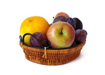 Basket with fruits isolated on a white background