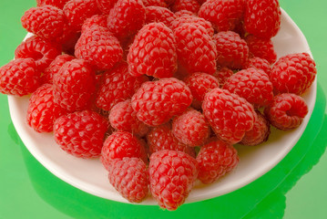 berries of  raspberry in  white plate