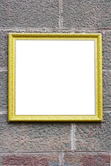 Fototapeta premium Blank antique frame over stone wall close-up