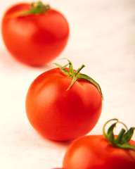 three red tomatoes