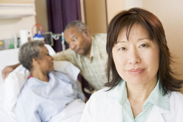 Fototapeta premium Nurse Standing In Hospital Room