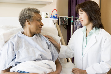 Fototapeta premium Doctor Talking To Senior Woman