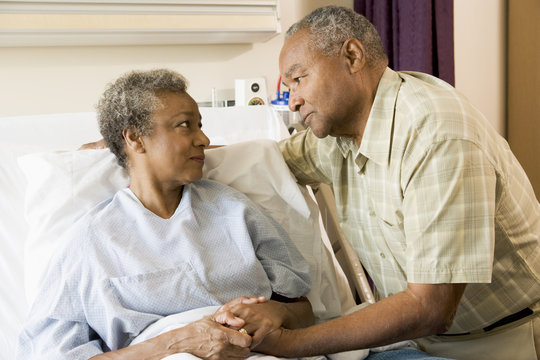 Senior Couple Standing In Hospital Together