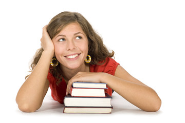 Teenage girl with stack of books