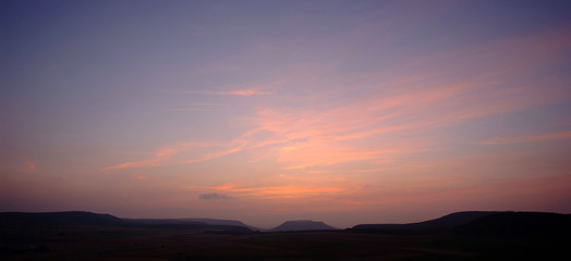 Naklejka premium Sunset over landscape