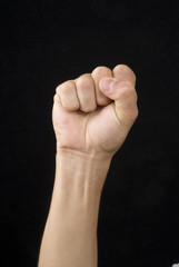 A hand whit victory signal in a black back