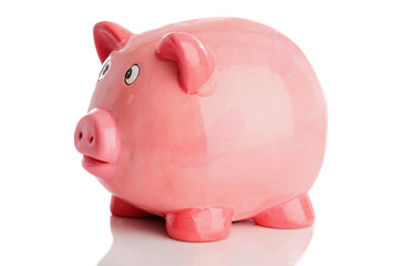 Pink money box a over white background