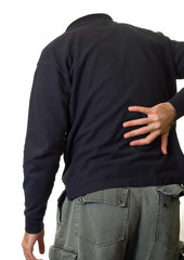 A person holding their lower back in pain