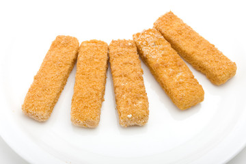 frozen fish fingers on a white plate