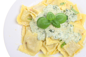 Ravioli pasta with a spinach and cheese sauce