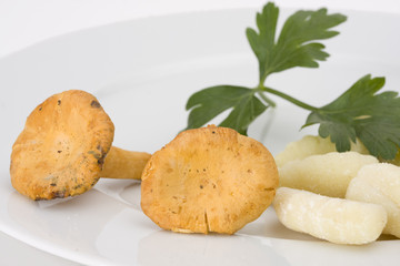 uncooked gnocchi noodles on a plate