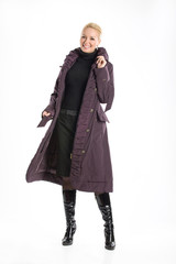 Young blonde woman in a raincoat