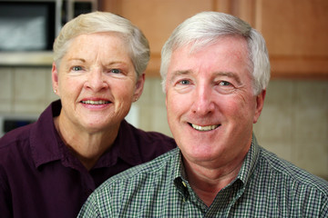 Happy Senior Couple Together In Their Home