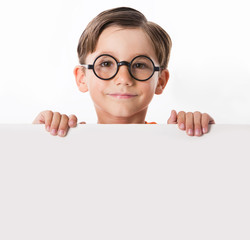 Face of youthful boy in glasses