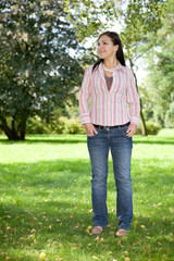 attractive brunette woman in park