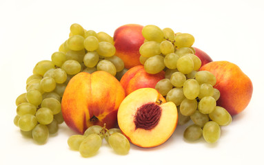 Bright, ripe fruit - grapes and nectarines. Object over white