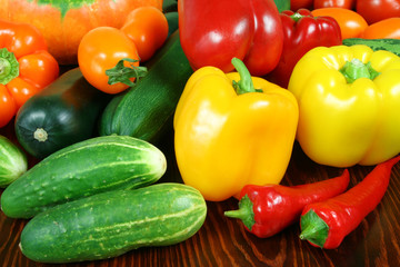 Vegetables on a table. Chili, peppers, tomatos, cucumbers.