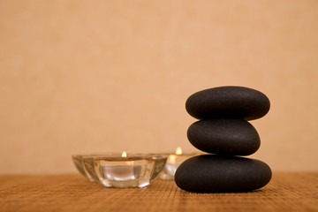 volcanic zen stones and candles for spa concept