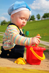 child play in sandbox