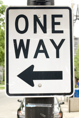 Black & white 'One Way' street sign