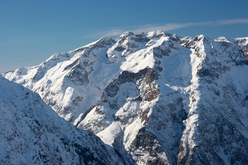 Fototapeta na wymiar High mountains covered by snow